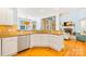 Kitchen with white cabinetry, granite countertops, stainless steel dishwasher, and a view into the living room at 2455 Talbot Ct, Sherrills Ford, NC 28673