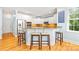 Stylish kitchen with white cabinets, a granite countertop island, and seating for four at the breakfast bar at 2455 Talbot Ct, Sherrills Ford, NC 28673