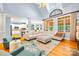 Bright and airy living room showcasing a large seating area with hardwood floors and large windows at 2455 Talbot Ct, Sherrills Ford, NC 28673