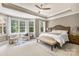 Serene main bedroom with large windows, plush carpet, and a cozy seating area at 2455 Talbot Ct, Sherrills Ford, NC 28673