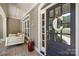 Inviting front porch featuring a cozy porch swing and stylish decor details at 2455 Talbot Ct, Sherrills Ford, NC 28673