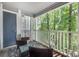 Private balcony featuring comfortable seating and views of lush greenery for relaxing outdoor living at 2510 Cranbrook Ln, Charlotte, NC 28207