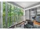 Relax on the balcony with wooded views, complete with outdoor seating and a stylish rug at 2510 Cranbrook Ln, Charlotte, NC 28207