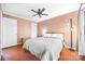 Warm bedroom showing neutral walls, wood floors, a ceiling fan, and a contemporary aesthetic at 2510 Cranbrook Ln, Charlotte, NC 28207