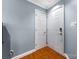 The entryway featuring a secure lock and classic white doors and trim at 2510 Cranbrook Ln, Charlotte, NC 28207