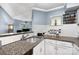 Kitchen featuring granite countertops, spice rack, and white cabinets at 2510 Cranbrook Ln, Charlotte, NC 28207