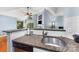Open kitchen with granite countertops that overlooks the living room at 2510 Cranbrook Ln, Charlotte, NC 28207