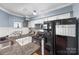 Charming kitchen with granite countertops, white cabinets, and modern appliances at 2510 Cranbrook Ln, Charlotte, NC 28207