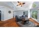 Open-concept living room with vaulted ceiling, hardwood floors, and access to the backyard at 2510 Cranbrook Ln, Charlotte, NC 28207