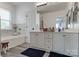 Bright bathroom featuring a double vanity, soaking tub, and clean, modern finishes at 2936 Saintfield Pl, Charlotte, NC 28270