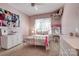 Pink bedroom featuring a bed with decorative pillows, window, and vanity at 2936 Saintfield Pl, Charlotte, NC 28270