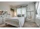 Charming bedroom featuring neutral tones, a cozy bed, and playful decorative accents at 2936 Saintfield Pl, Charlotte, NC 28270