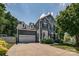 Charming two-story home with a well-maintained lawn, beautiful landscaping, and a two-car garage at 2936 Saintfield Pl, Charlotte, NC 28270