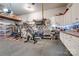 Well-organized garage featuring a workbench, bike storage, and ample shelving for tools and supplies at 2936 Saintfield Pl, Charlotte, NC 28270