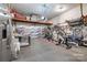 Spacious garage with overhead storage racks and organized fitness equipment, creating a functional space at 2936 Saintfield Pl, Charlotte, NC 28270