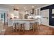 Stylish kitchen featuring butcher block island with seating, white cabinets, and stainless steel appliances at 2936 Saintfield Pl, Charlotte, NC 28270