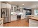 Modern kitchen featuring stainless steel appliances, white cabinetry, butcher block countertops, and hardwood floors at 2936 Saintfield Pl, Charlotte, NC 28270