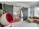 Bright living room with modern furniture, accent rug, and sliding barn doors leading to the dining area at 2936 Saintfield Pl, Charlotte, NC 28270
