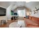 Comfortable room featuring an expansive sectional sofa, desk and artistic touches at 2936 Saintfield Pl, Charlotte, NC 28270