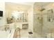 Spa-like bathroom with marble shower, soaking tub, and vanity area at 3015 Rochester Ct, Monroe, NC 28110