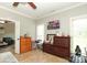 Bedroom boasts tile floors, TV, ceiling fan, and an abundance of natural light at 3015 Rochester Ct, Monroe, NC 28110