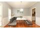 Cozy dining nook features a modern chandelier and booth seating at 3015 Rochester Ct, Monroe, NC 28110