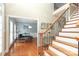 Spacious foyer with wood floors, staircase, and dining area at 3015 Rochester Ct, Monroe, NC 28110