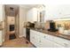 Functional kitchen with white cabinets, granite countertops, and stainless steel dishwasher at 3015 Rochester Ct, Monroe, NC 28110
