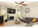Bright living room with fireplace, large TV and comfortable sectional sofa at 3015 Rochester Ct, Monroe, NC 28110