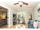Bright room features a ceiling fan, tile floors, and an exercise bike at 3015 Rochester Ct, Monroe, NC 28110