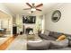 Sunlit living area with fireplace, TV, and cozy sectional seating at 3015 Rochester Ct, Monroe, NC 28110