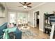 Bright sunroom features tile floors, ceiling fan, and natural light at 3015 Rochester Ct, Monroe, NC 28110