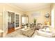 Elegant living room featuring neutral tones, plush seating, and a decorative mirror at 3015 Rochester Ct, Monroe, NC 28110