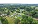 An aerial view of a home with a well-maintained lawn, privacy fence and in-ground pool in the neighborhood at 3545 Yorkland Dr, Hickory, NC 28601