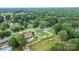 Aerial view of the home featuring a well-maintained lawn, privacy fence, pool, and mature trees at 3545 Yorkland Dr, Hickory, NC 28601