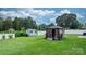 Backyard featuring a storage shed and gazebo in the well-kept yard at 3545 Yorkland Dr, Hickory, NC 28601