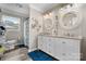 Bright bathroom with double sink vanity, granite counters, framed mirrors, and updated fixtures at 3545 Yorkland Dr, Hickory, NC 28601