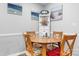Cozy dining area featuring a round table, wood chairs, beach themed decor and built in storage at 3545 Yorkland Dr, Hickory, NC 28601