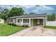 Inviting home featuring a covered porch, well-maintained landscaping, and an extended driveway at 3545 Yorkland Dr, Hickory, NC 28601