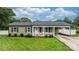 Charming home with well-manicured lawn, landscaping and covered side entrance for convenient parking at 3545 Yorkland Dr, Hickory, NC 28601