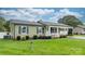 Landscaped front yard, charming porch, and updated home exterior create curb appeal at 3545 Yorkland Dr, Hickory, NC 28601