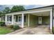 Inviting home with a charming front porch, carport, and well-maintained landscaping at 3545 Yorkland Dr, Hickory, NC 28601