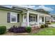 Charming front porch with white railing, columns, and a welcoming wreath on the door, creating a cozy entrance at 3545 Yorkland Dr, Hickory, NC 28601