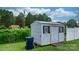 View of storage shed in backyard with a trash can outside at 3545 Yorkland Dr, Hickory, NC 28601