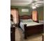 Traditional bedroom featuring a bed, wooden furniture, curtains, and neutral colored carpet at 3810 Spike Ln, Vale, NC 28168