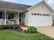 Welcoming home featuring a front porch and attached two-car garage at 3810 Spike Ln, Vale, NC 28168
