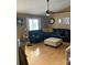 Spacious living room featuring a large black leather couch, hardwood floors, and natural light at 3810 Spike Ln, Vale, NC 28168