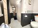 Bathroom featuring a bathtub and black and white tile at 402 Madison St, Lincolnton, NC 28092