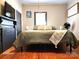 Bedroom featuring wooden floors at 402 Madison St, Lincolnton, NC 28092