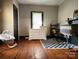 Bedroom featuring wooden floors, and a black and white rug at 402 Madison St, Lincolnton, NC 28092